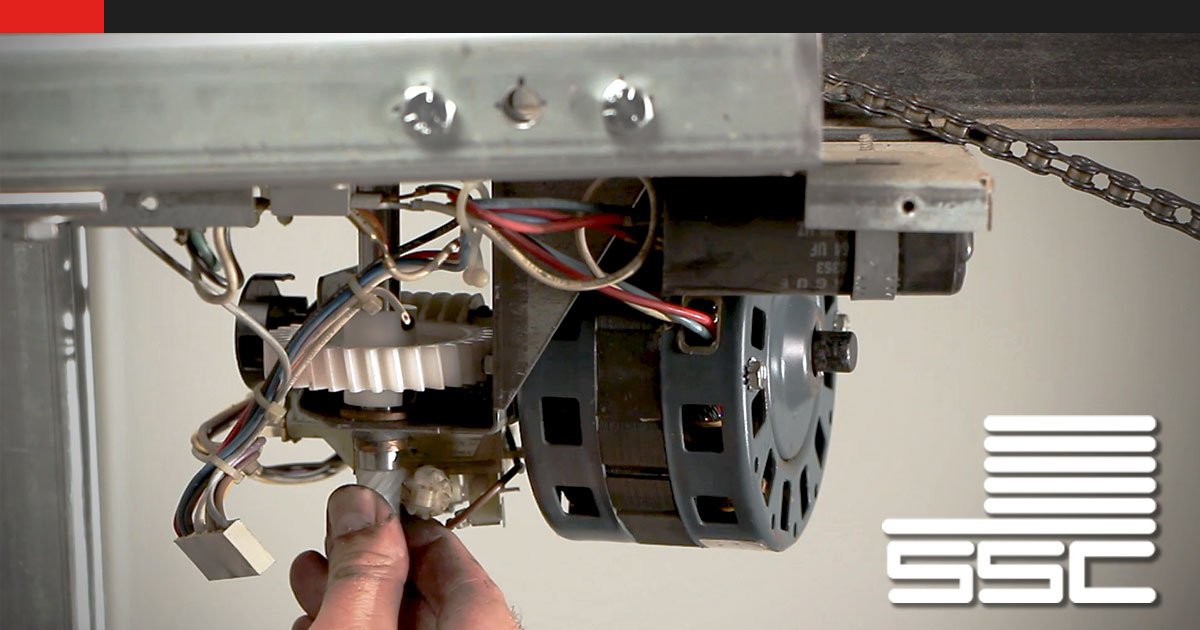 Close up of a garage door drive gear.