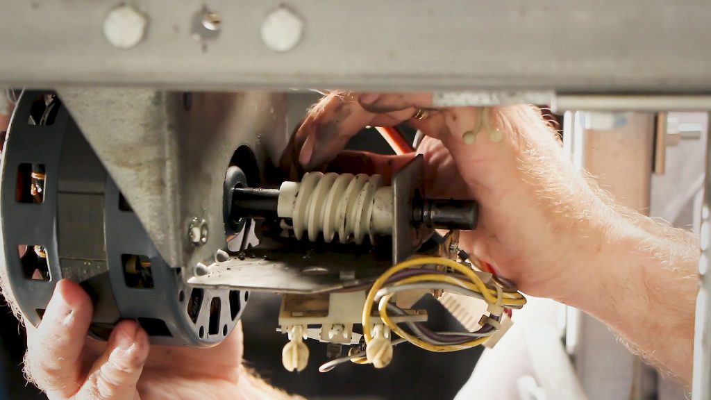 Image of a garage door opener worm gear repair.
